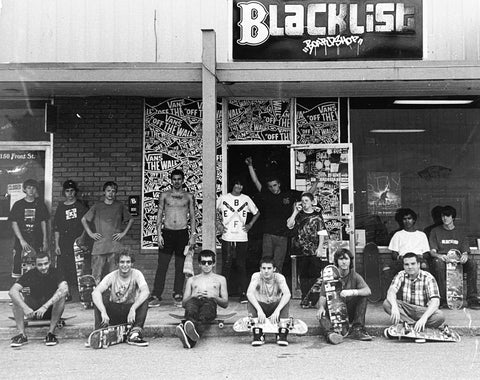 Vintage black-and-white photo of the Blacklist skate crew posed outside the original Front Street shop