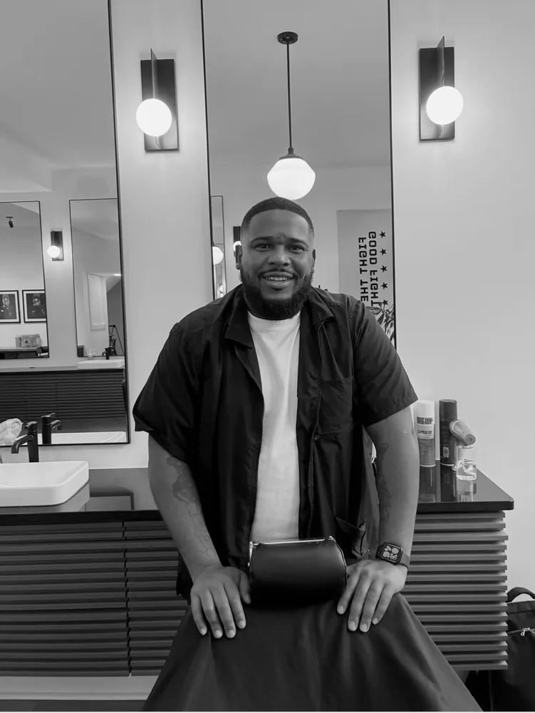Portrait of Charles, barber at the East Price Hill location
