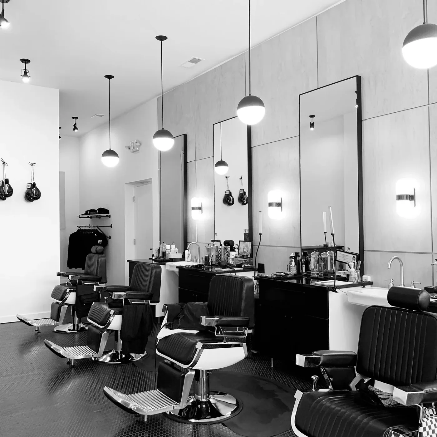 Row of barber chairs and mirrors at the Walnut Hills location