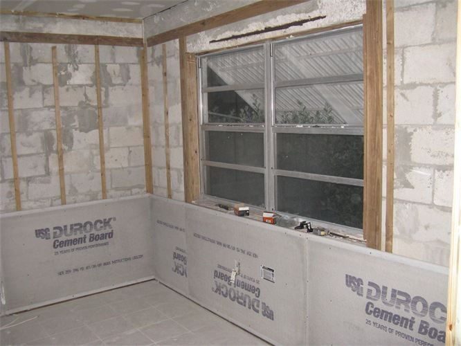 Interior wall preparation and cement board installation