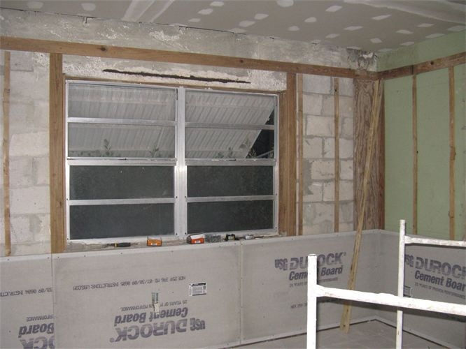 Interior wall preparation and cement board installation