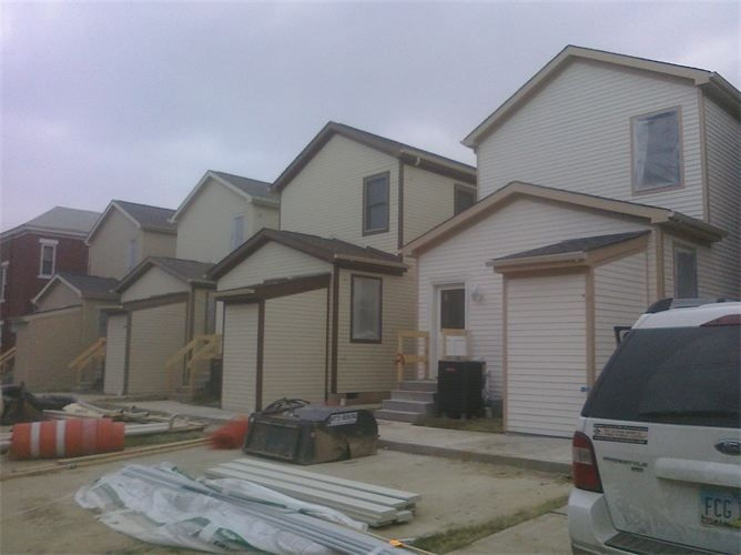 Exterior painting at a new-construction townhome development